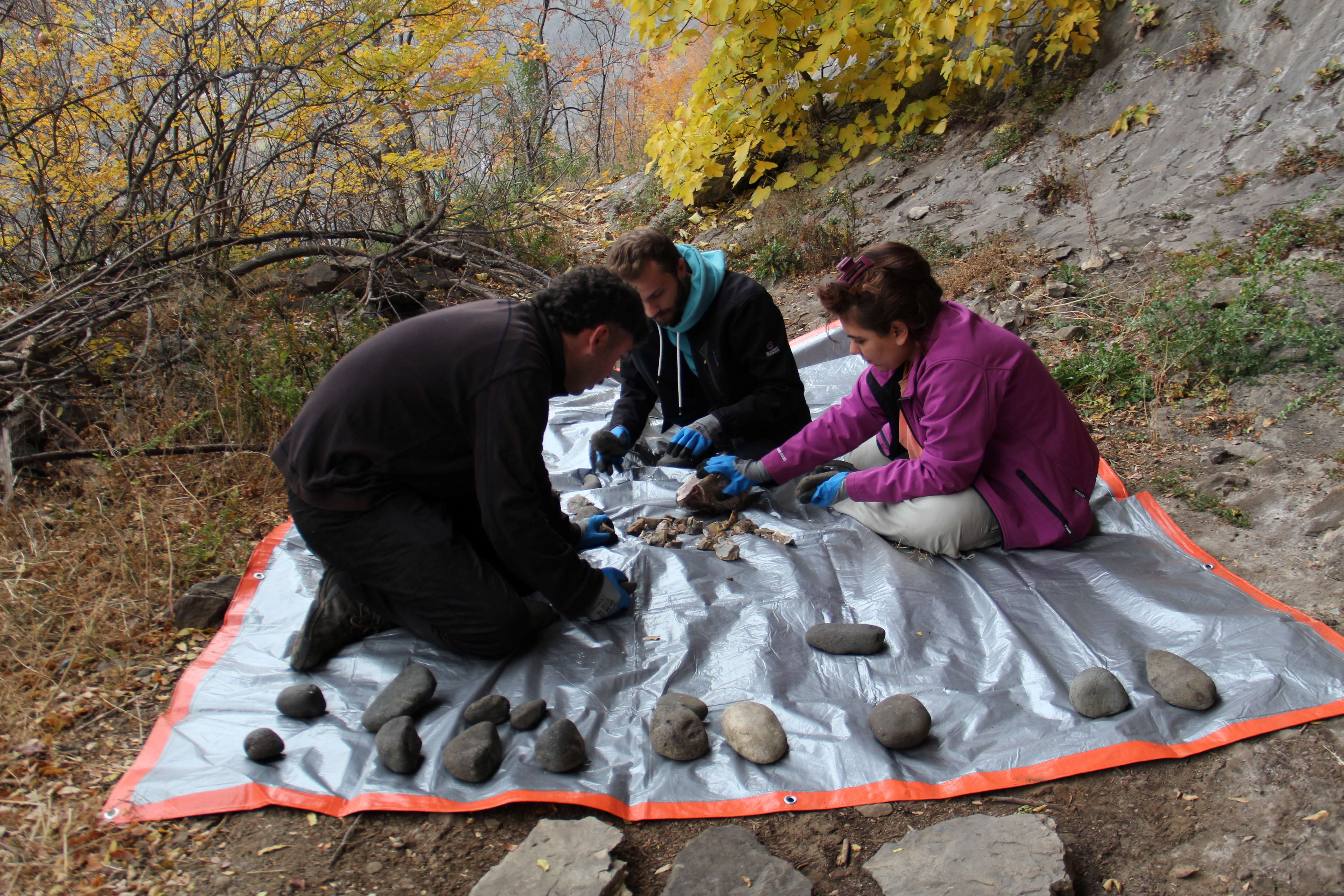 Flintknapping process (from the left: Levan Losaberidze, Vladimer Kenkadze, Mariam Kokhreidze; Photo by Aleko Zavradashvili)