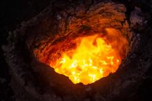 The bloom glowing inside the furnace