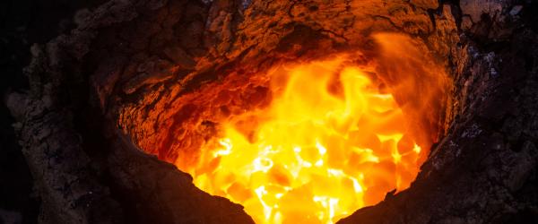 The bloom glowing inside the furnace